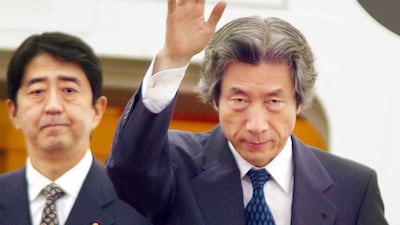 This file photo taken on September 17, 2002 shows Japanese Prime Minister Junichiro Koizumi, accompanied by then-Vice Cabinet Secretary Shinzo Abe as he leaves Tokyo International Airport for Pyongyang to meet with then-North Korean leader Kim Jong Il. AFP