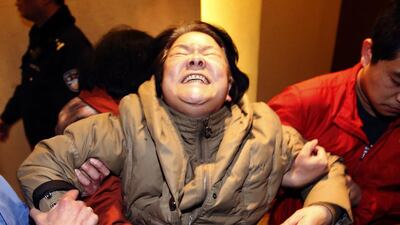 A relative of passengers aboard the Malaysia Airlines MH370 cries at the Lido hotel in Beijing after hearing the announcement on the missing flight by Malaysian prime minister Najib Razak. Kim Kyung-Hoon / Reuters