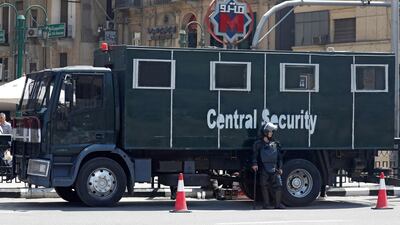 An Egyptian riot police officer outside El Sadat metro station at Tahrir Square in central Cairo, Egyptm on May 13, 2018, following protests over fare hikes. Reuters
