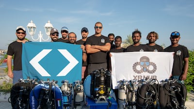Simon Nadim, with his arms crossed, led the team that completed a 144-metre dive of Fujairah. Photo: Chris Chellapermal / XR Hub