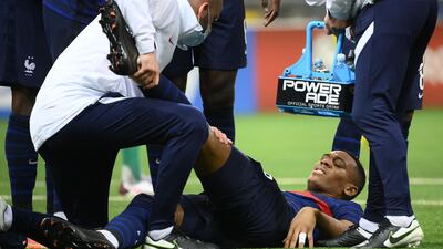 France forward Anthony Martial recieves treatment after picking up an injury. AFP