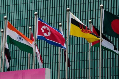 Flags of participating countries, among them North Korea, India, and Brunei, at the Athletes Village at the 19th Asian Games in Hangzhou, China, on Thursday. AP