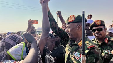 AL DABBAH, SUDAN - NOVEMBER 8: Sudan's Sovereignty Council Chairman and Army Commander Gen. Abdel Fattah al-Burhan visits the newly established Al-Afadh camp in Al Dabbah, Northern State, where tens of thousands of Sudanese have taken refuge after being displaced by clashes following the Rapid Support Forces' takeover of El Fasher, the capital of North Darfur, on October 26, in Al Dabbah, Sudan, on November 8, 2025. (Photo by Stringer/Anadolu via Getty Images)