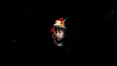 A Hindu girl dressed as a Kumari sits as she is worshipped during rituals to commemorate Navratri festival inside Adyapith temple on the outskirts of Kolkata, India. Rupak De Chowdhuri / Reuters