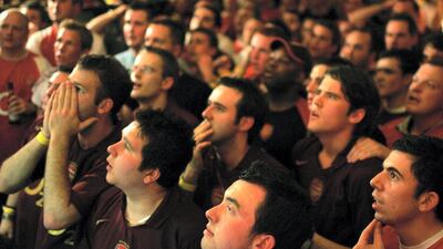Arsenal fans watch the Champions League final on a big screen. Getty