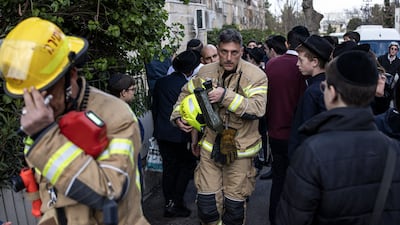 A firefighter leaves the site of the nursery tragedy in West Jerusalem. AFP