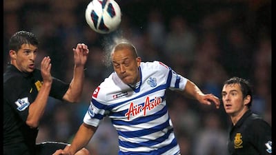 Queens Park Rangers' Bobby Zamora heads the ball ahead of Everton's Kevin Mirallas and Leighton Baines during their English Premier League soccer match at Loftus Road in London. Eddie Keogh / Reuters