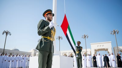 Military personnel prepare to raise the national flag at Qasr Al Watan. Photo: WAM