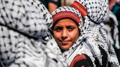 Palestinian children dressed in traditional dress attend a march marking Palestinian traditional customs day, in Gaza City. AFP