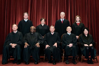 Members of the Supreme Court pose for a group photo at the Supreme Court in Washington on April 23, 2021. Seated from left are Associate Justice Samuel Alito, Associate Justice Clarence Thomas, Chief Justice John Roberts, Associate Justice Stephen Breyer and Associate Justice Sonia Sotomayor. Standing from left are Associate Justice Brett Kavanaugh, Associate Justice Elena Kagan, Associate Justice Neil Gorsuch and Associate Justice Amy Coney Barrett. AP, Pool