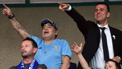 Diego Maradona watches a game from the stands. AFP