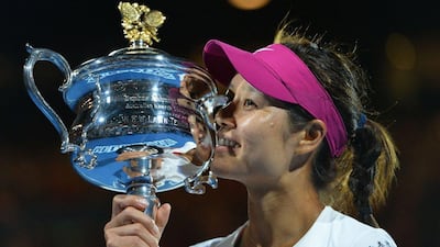 Li Na shown after winning this year's Australian Open. Chinese state media reported on Thursday, September 18, 2014, that she would be retiring from professional tennis. Saeed Khan / AFP
