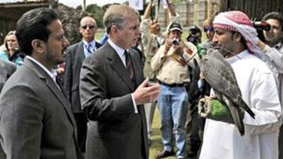 Sheikh Sultan Bin Tahnoun, chairman of the Abu Dhabi Tourism Authority, presents Prince Andrew with the gyrfalcon.
