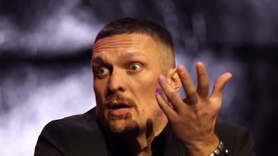 Oleksandr Usyk reacts during the press conference at Outernet London. Getty