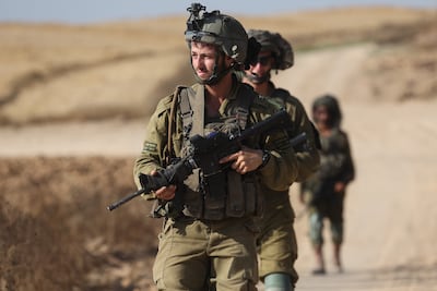 Israeli soldiers patrol along the border with Gaza. EPA
