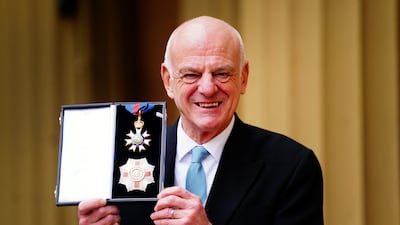 David Nabarro poses after he was made a Knight Commander of the Order of St Michael and St George during an investiture ceremony at Buckingham Palace in London. Reuters