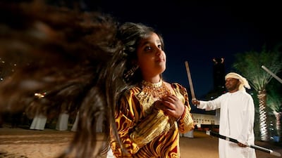 Maitha Yaqoob, 10, performs a traditional Emirati Dance during the Qasr Al Hosn festival in Abu Dhabi February 20, 2014. Sammy Dallal / The National