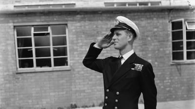 Lieutenant Philip Mountbatten, prior to his marriage to Princess Elizabeth, saluting as he resumes his attendance at the Royal Naval Officers School at Kingsmoor, England, on July 31, 1947. Getty Images