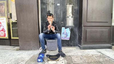 A young man busks for money in Jabal al Weibdeh, Jordan. Amy McConaghy / The National