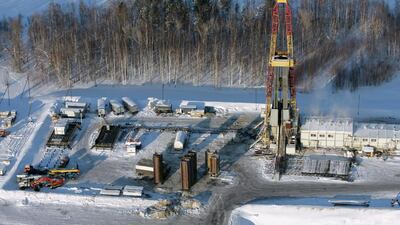 One of Yuganskneftegaz derricks in Priobskoe oilfield some 200km from Nefteyugansk, Russia. Mr Putin says Russia will freeze or cut output. Yuri Kochetkov / EPA