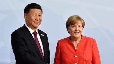 Mrs Merkel with the Chinese President Xi Jingping. John MacDougall / AFP Photo