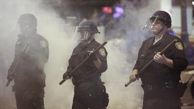 Police officers disperse a crowd celebrating on the streets of Seattle, Washington, after the hometeam won the NFL Super Bowl XLVIII on February 3, 2014. The Seattle Seahawks beat the Denver Broncos 43-8 in East Rutherford, New Jersey, on Sunday, to win their first NFL championship. Jason Redmond / Reuters