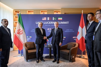 Abbas Araghchi, left, with Switzerland's Foreign Minister Ignazio Cassis in Burgenstock. AFP