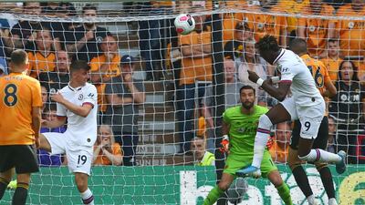 Tammy Abrahamn, second right, heads home Chelsea's third goal against Wolves at Molineux. AFP