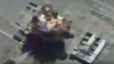 This frame grab provided on Thursday, October 5, 2017, by the Russian defence ministry press service, is claimed to show a target in Syria being hit by a missile launched from a Russian submarine in the Mediterranean. The Associated Press