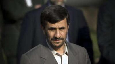 Iran's President Mahmoud Ahmadinejad arrives at the presidential office to attend a welcoming ceremony for his Syrian counterpart Bashar al Assad in Tehran.