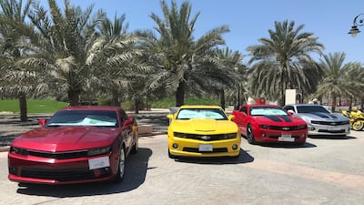 Several Chevrolet Camaros represent modern muscle cars at the show. Adam Workman / The National