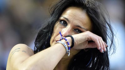 A football fan wipes a tear after Inter Milan’s Argentinian defender Javier Zanetti greets fans. Olivier Morin / AFP Photo