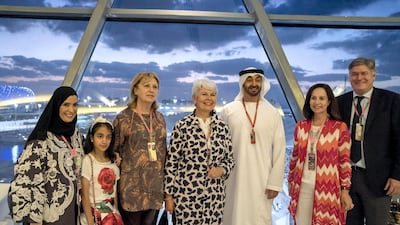 Sheikh Mohammed stands for a photograph with Dr Amal Abdullah Al Qubaisi, Speaker of the Federal National Council (L), and guests. Mohamed Al Hammadi / Crown Prince Court - Abu Dhabi