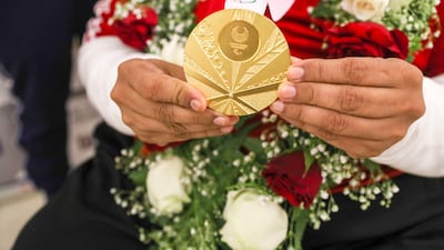 Abdulla Sultan Al Aryani shows off his gold medal.