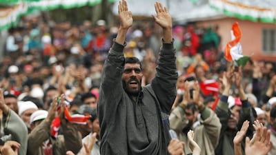 A supporter of Kashmir's ruling National Conference party shout slogans during an election campaign rally addressed by Kashmir's chief minister Omar Abdullah, at Duroo, south of Srinagar. Danish Ismail / Reuters