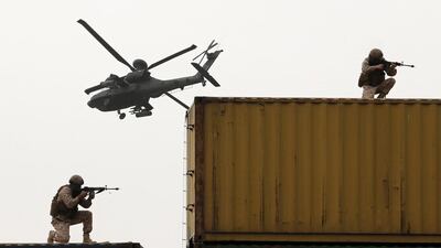 UAE military take to the roof during the show to mark the opening of Idex 2015. AFP
