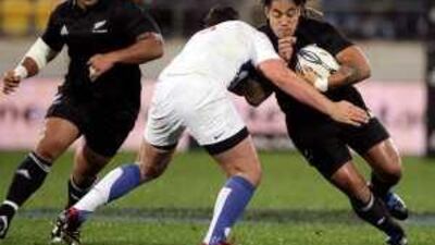 All Blacks' Ma'a Nonu, right, is tackled by the French defence during the second Test in Wellington yesterday. The hosts won 14-10.