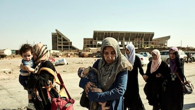 Civilians flee fighting in the Old City of Mosul. Zach Lowry / SOPA Images / LightRocket via Getty Images