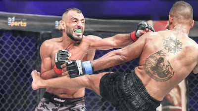 Brave Combat Federation 27 at the Mubadala Arena. Bantamweight: (R-L) Jalal Al Daaja (JOR) gives a roundhouse kick during his bout against Tariq Ismail (CAN). Victor Besa / The National