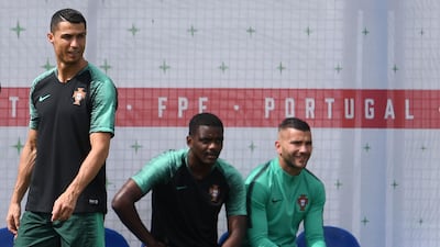 Cristiano Ronaldo, left, continues to attract plenty of attention at the World Cup. Francisco Leong / AFP