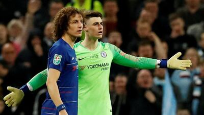 Chelsea goalkeeper Kepa Arrizabalaga, right, refuses to be substituted during Sunday's League Cup final against Manchester City at Wembley. Reuters