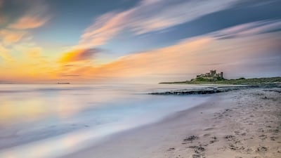 6. Early morning views of the shore line and beach near to Bamburgh Castle in Northumberland, UK.