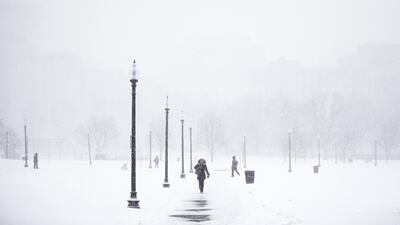 Pedestrians walk through the Boston Common during a snow storm in Boston. Adam Glanzman/Bloomberg