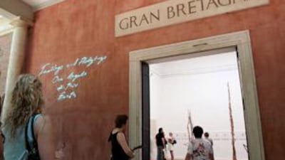 Visitors look at the installation by the British artist Tracey Emin exhibited at the British pavillion during the 2007 Venice Biennale.