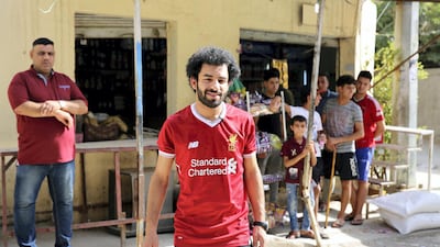 Iraqi footballer Hussein Ali paid $40 for the official Liverpool shirt after Mohamed Salah's successful first season in the Premier League. Sabah Arar / AFP