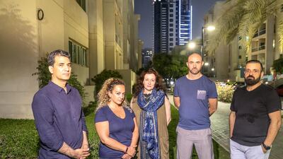 Residents of The Greens say they have not been able to contact anyone about the intrusive lighting. From left to right, Shahid Mahmood Alarta, Maryam Zandi, Melanie Hunt, Steven Reilly and Ekin Bingol. Antonie Robertson / The National