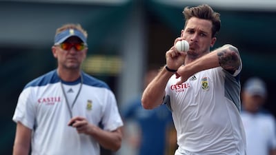 South African bowling coach Alan Donald, left, looks on as fast bowler Dale Steyn delivers a ball during a training session at the Sydney Cricket Ground. AFP PHOTO / INDRANIL MUKHERJEE
