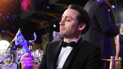 Kieran Culkin with his award for Outstanding Performance by an Ensemble in a Drama Series for 'Succession'. AFP