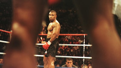 Mike Tyson looks across the ring at Frank Bruno prior to the start of the first round of the WBC Heavyweight Championship bout at the MGM Grand in Las Vegas, Nevada. All photos by Getty Images