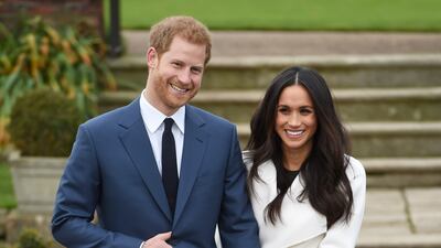 Prince Harry and Meghan during a photo call to announce their engagement at The Sunken Gardens at Kensington Palace, in November 2017. Getty Images